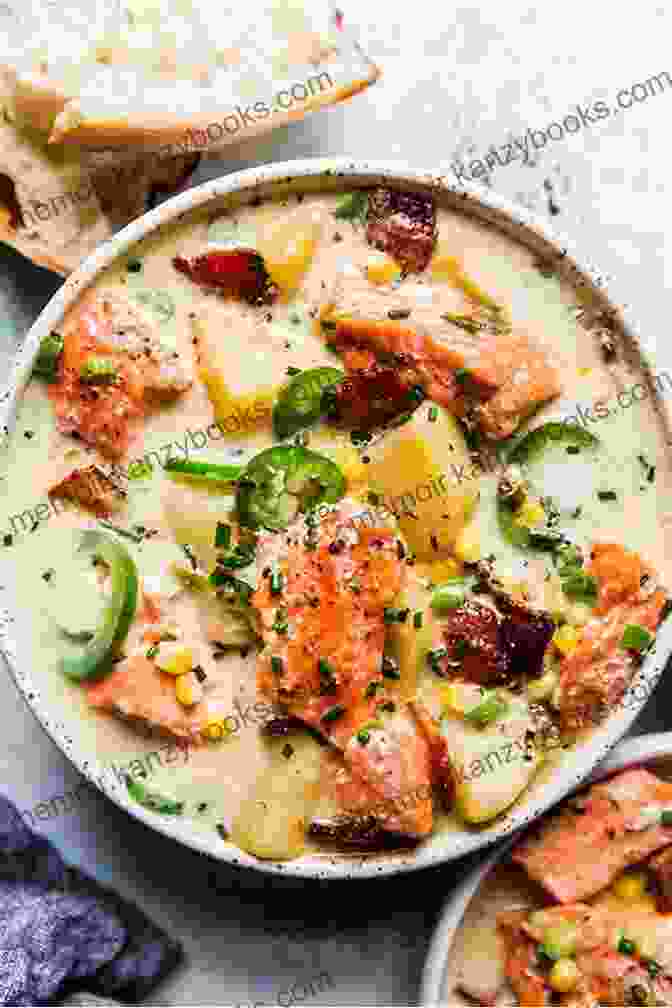 A Bowl Of Creamy Salmon Chowder Filled With Salmon Chunks, Potatoes, And Herbs Canadian Cuisine: Delicious Canadian Recipes: Recipes From Canadian