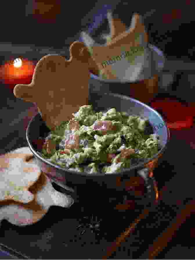 A Bowl Of Ghostly Guacamole, Served In A Hollowed Out Avocado And Topped With Ghost Shaped Tortilla Chips. Best Of Recipes For Halloween Parties: A Compilation Of 30 + Fun Recipes For Your Party That Adults And Kids Will Enjoy