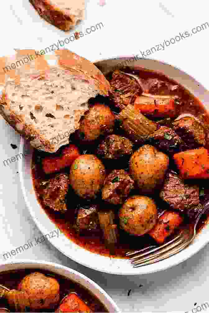 A Steaming Bowl Of Beef Stew, Garnished With Fresh Herbs And A Crusty Bread Roll Paleo Slow Cooker Soups And Stews: Healthy Family Gluten Free Recipes