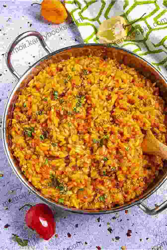 A Steaming Bowl Of Jollof Rice, Its Vibrant Orange Hue And Aromatic Steam Tantalizing The Senses. MAKING NIGERIAN DISHES: THE COMPLETE GUIDE TO NIGERIAN CUISINES (JOLLOF RICE AND OGBONO SOUP)