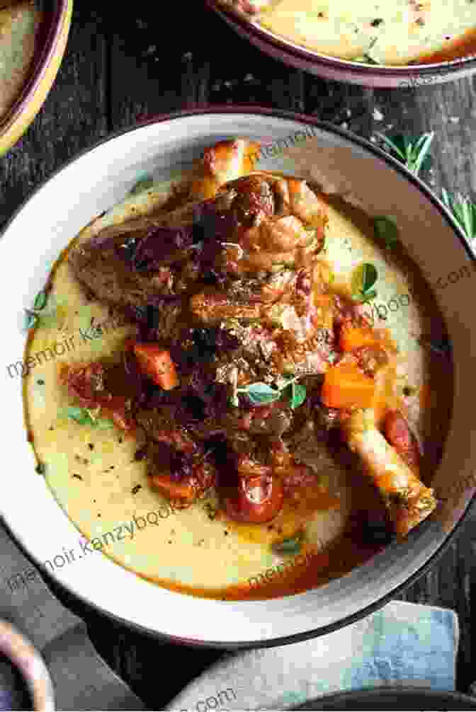 Tender Braised Lamb Shanks On A Bed Of Creamy Polenta, Garnished With Fresh Herbs And A Drizzle Of Olive Oil Slow Fires: Mastering New Ways To Braise Roast And Grill: A Cookbook